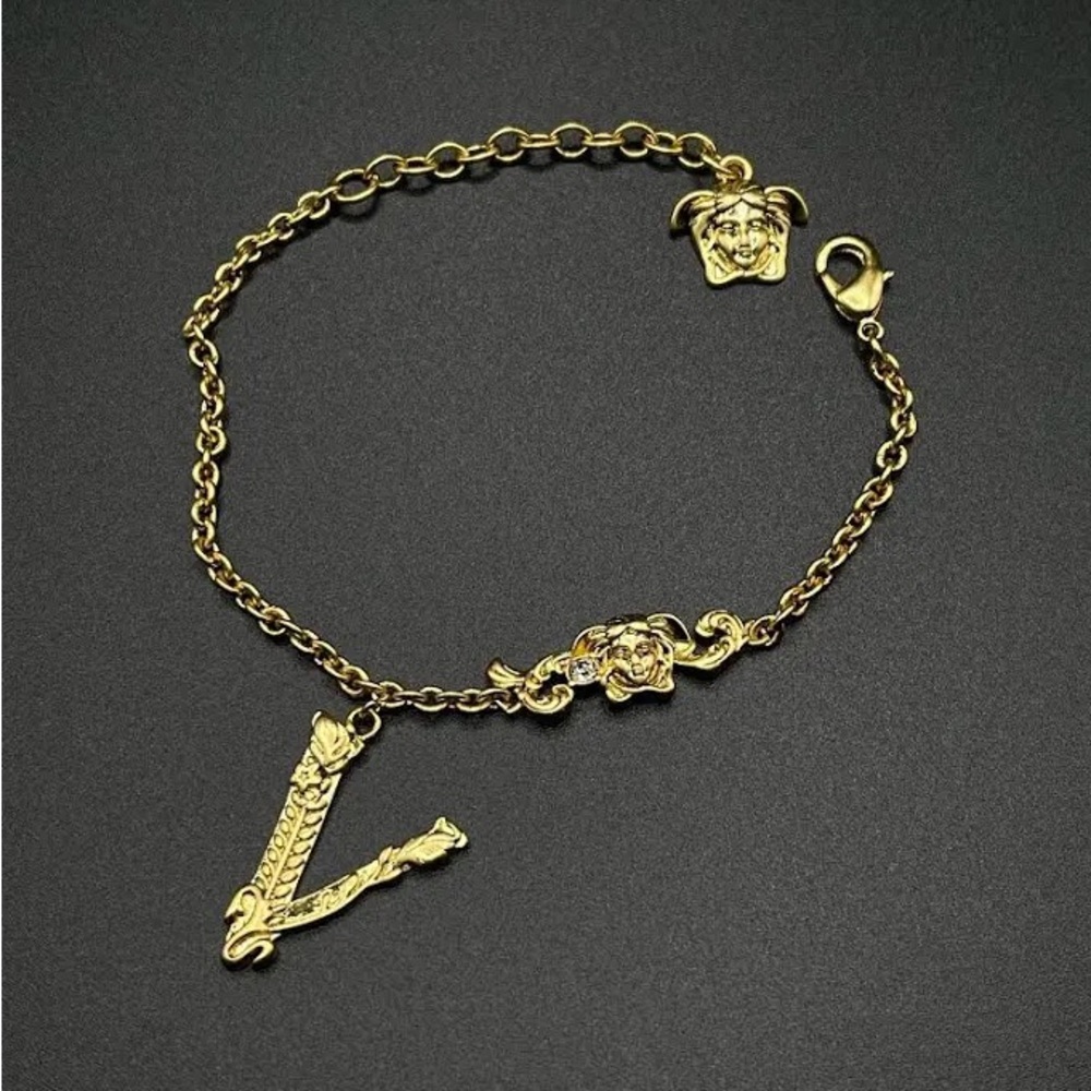 VERSACE GOLD CHARM BRACELET VINTAGE